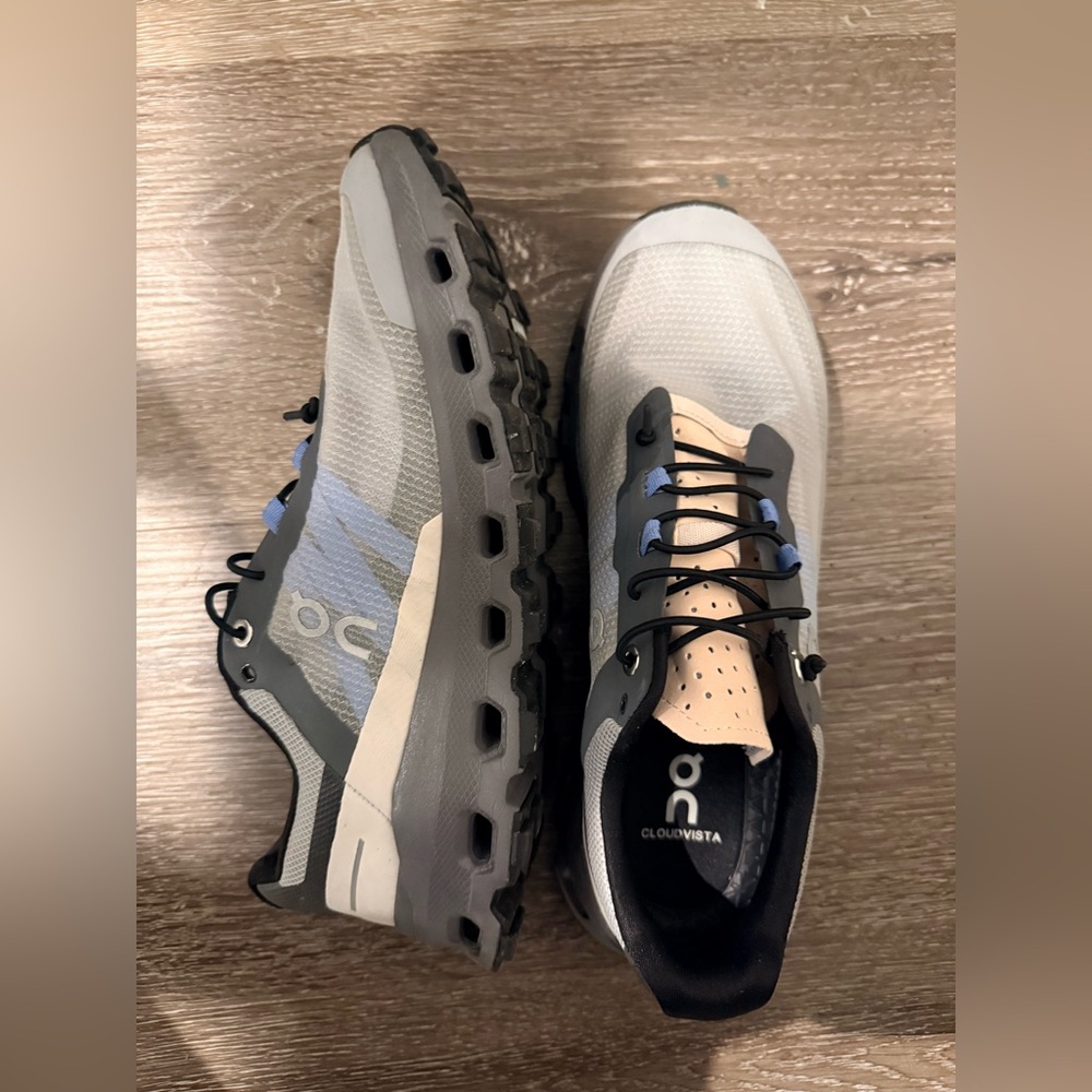 On Running Cloudvista Gray and Black Sneakers with Blue Highlights